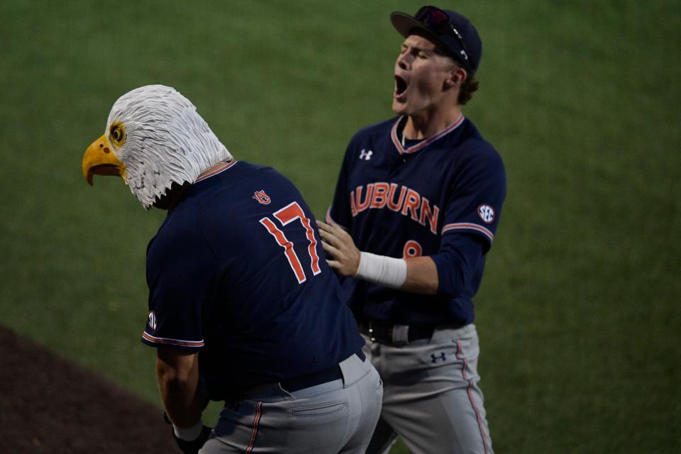 Auburn infielder Sonny DiChiara (17) celebrates a home run hit with an eagle mask with Auburn outfielder Bryson Ware (8) during a game at Lindsey Nelson Stadium in Knoxville, Tenn. on Saturday, April 30, 2022.