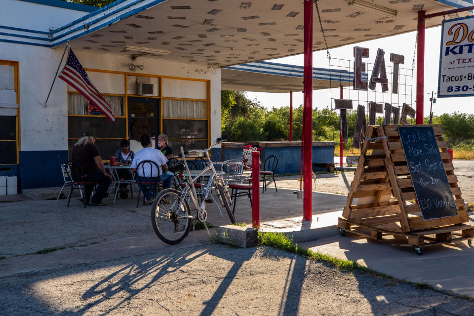Richard Gonzalez, Sergio Gutierrez and Moises Lozano meet at Darla’s Kitchen for breakfast tacos on most mornings in Brackettville, Texas, on Aug. 10, 2022. (Kaylee Greenlee Beal for NBC News)