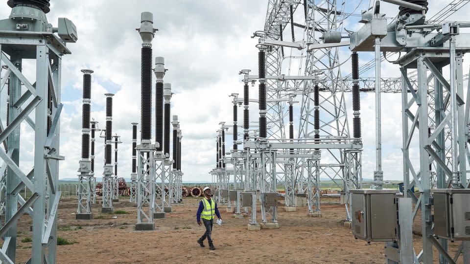 An engineer walks through a China-built power station in Kenya. - Han Xu/Xinhua/Getty Images