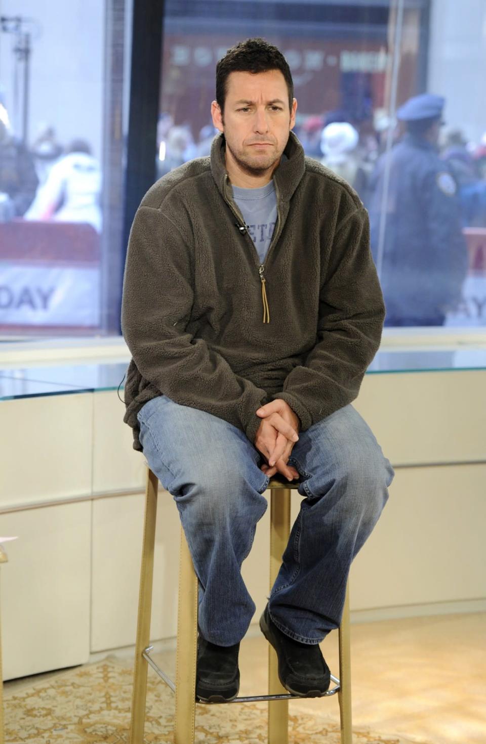 <p>Sandler seemed to be having doubts about his decision to wear a fleece on the <i>Today</i> show. (Photo: Peter Kramer/NBC/NBCU Photo Bank via Getty Images)</p>