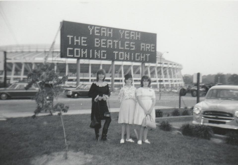 For her 13th birthday, Dianne Walls Anderson (left) attended her first Beatles concert in Atlanta 1965 with her two cousins, Nancy and Winnie. Anderson wore a dress sewn by her grandmother and black go-go boots.