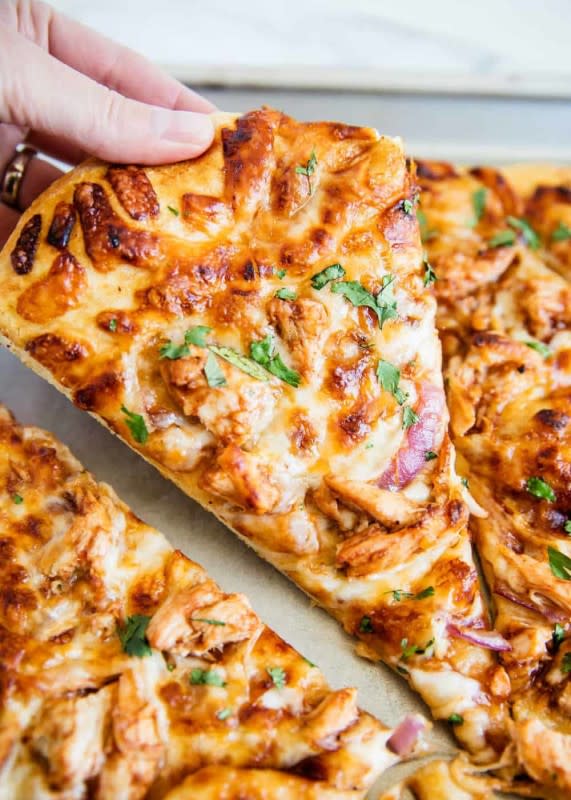 <p>I Heart Naptime</p><p>This BBQ chicken pizza is topped with BBQ sauce, shredded chicken, mozzarella, red onion and cilantro. It has tons of flavor and is ready in just 30 minutes!</p><p><strong>Get the recipe: <a href="https://www.iheartnaptime.net/easy-bbq-chicken-pizza-recipe/" rel="nofollow noopener" target="_blank" data-ylk="slk:Easy BBQ Chicken Pizza;elm:context_link;itc:0;sec:content-canvas" class="link rapid-noclick-resp">Easy BBQ Chicken Pizza</a></strong></p>