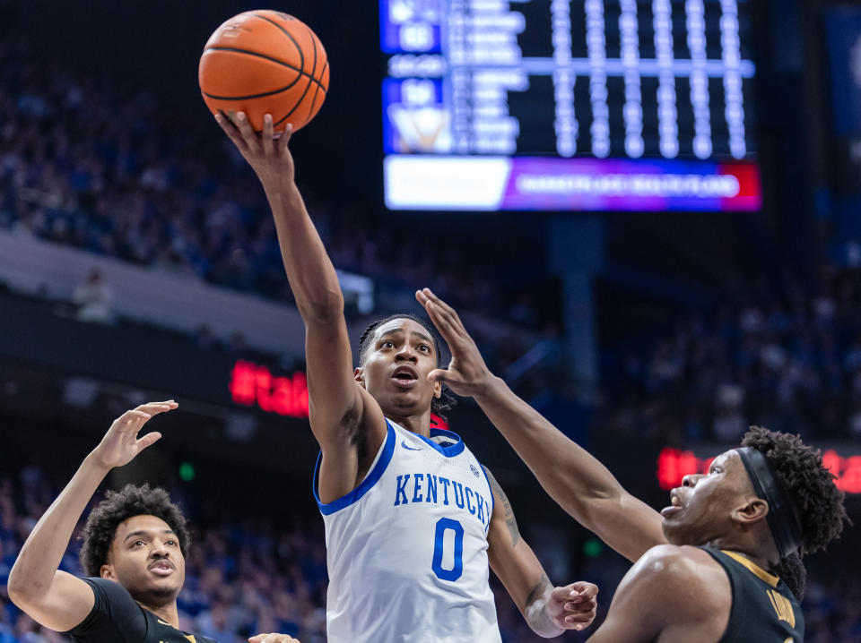 LEXINGTON, KENTUCKY - MARCH 6: Rob Dillingham #0 of the Kentucky Wildcats shoots the ball against Ven-Allen Lubin #2 of the Vanderbilt Commodores during the second half at Rupp Arena on March 6, 2024 in Lexington, Kentucky. (Photo by Michael Hickey/Getty Images)