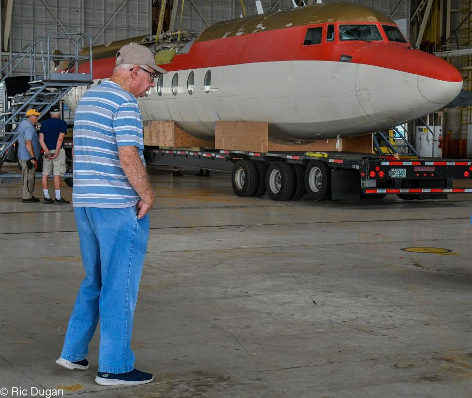 Ben Ryland Sr. of Hagerstown walks in front of the fuselage of a Fairchild F-27 after it was delivered to the Hagerstown Aviation Museum on Thursday. Ryland was an employee of Fairchild and was part of the crew that built F-27 planes.