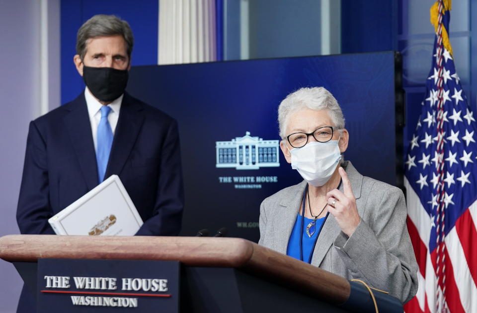 U.S. climate envoy John Kerry listens as climate adviser Gina McCarthy speaks during a press briefing at the White House in Washington, U.S., January 27, 2021.  REUTERS/Kevin Lamarque