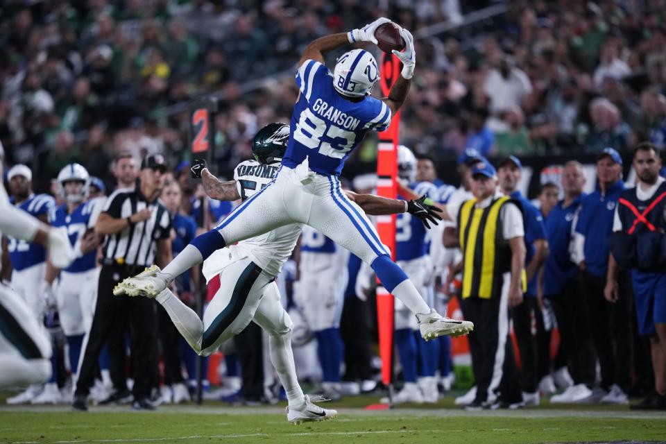 Indianapolis Colts tight end Kylen Granson (83) makes a catch in front of Philadelphia Eagles linebacker Ben VanSumeren (57) during the first half of an NFL preseason football game Thursday, Aug. 24, 2023, in Philadelphia. (AP Photo/Matt Slocum)