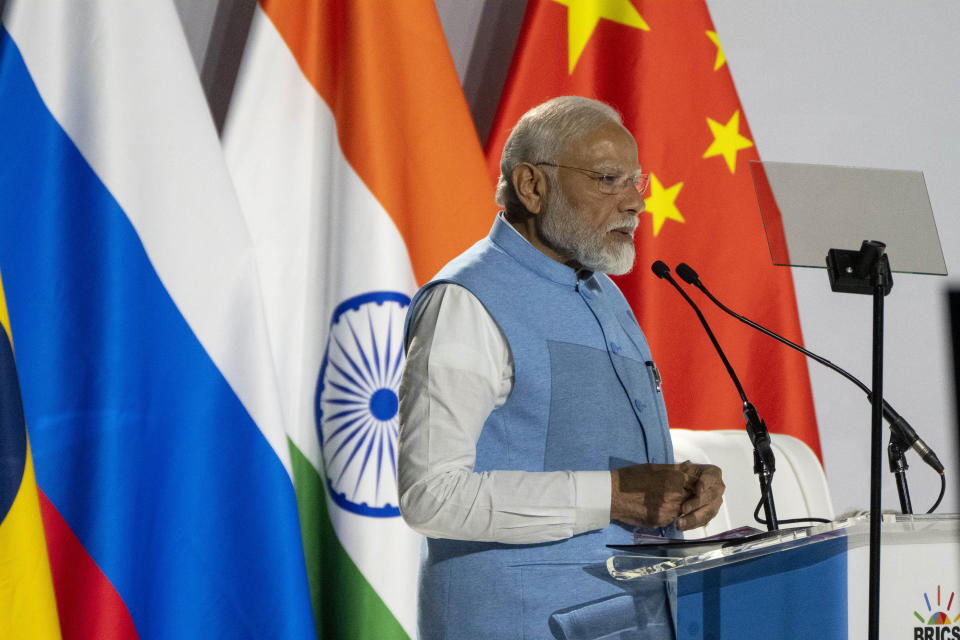 Indian Prime Minister Narendra Modi addresses leaders from the BRICS group of emerging economies at the start of a three-day summit in Johannesburg, South Africa , Tuesday, Aug. 22, 2023. (AP Photo/Jerome Delay)