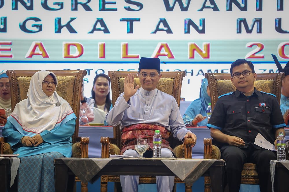 PKR deputy president Datuk Seri Azmin Ali (centre) with PKR Youth chief Akmal Nasrullah (right) and Wanita PKR chief Haniza Mohamed Talha at the opening of the 2019 Woman and Youth National Congress in Melaka December 5, 2019. — Picture by Yusof Mat Isa