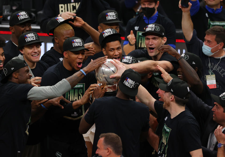 Members of the Milwaukee Bucks hold the Eastern Conference Finals trophy after defeating the Atlanta Hawks at State Farm Arena on July 03, 2021 in Atlanta, Georgia NOTE TO USER: User expressly acknowledges and agrees that, by downloading and or using this photograph, User is consenting to the terms and conditions of the Getty Images License Agreement. (Photo by Kevin C. Cox/Getty Images)