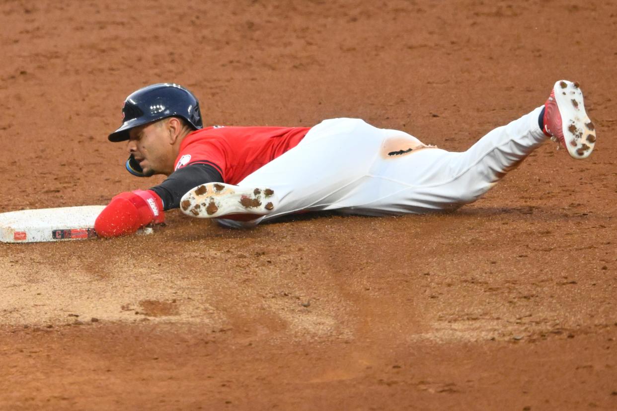 Aug 24, 2024; Cleveland, Ohio, USA; Cleveland Guardians second baseman Andres Gimenez (0) steals second base in the second inning against the Texas Rangers at Progressive Field. Mandatory Credit: David Richard-USA TODAY Sports