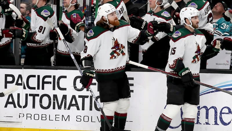 Arizona Coyotes center Liam O'Brien, front left, celebrates after a first-period goal in a game against the San Jose Sharks in San Jose, Calif., Sunday, April 7, 2024.