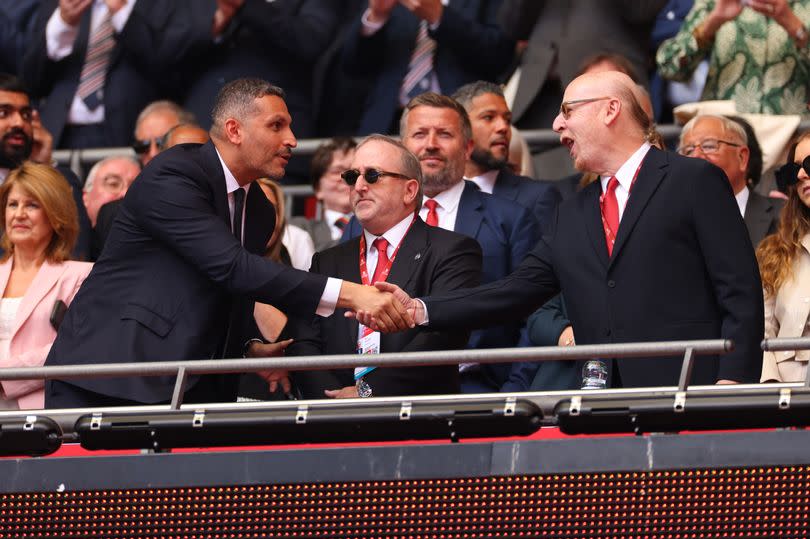 Manchester City chairman Khaldoon Al-Mubarak shakes hands with Manchester United co-chairman Avram Glazer at the 2023 FA Cup final