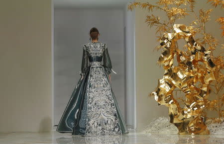 A model presents a creation by Chinese designer Guo Pei as part of her Haute Couture Spring/Summer 2016 collection in Paris, France January 27, 2016. REUTERS/Gonzalo Fuentes