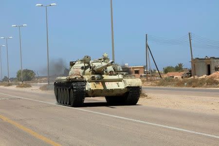 A tank from forces aligned with Libya's new unity government is seen on a road in Sirte, June 30, 2016. REUTERS/Ismail Zitouny