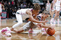 Ohio State guard Jacy Sheldon, right, and Michigan State guard DeeDee Hagemann, left, vie for the ball during the first half of an NCAA college basketball game, Sunday, Feb. 11, 2024, in East Lansing, Mich. (AP Photo/Al Goldis)