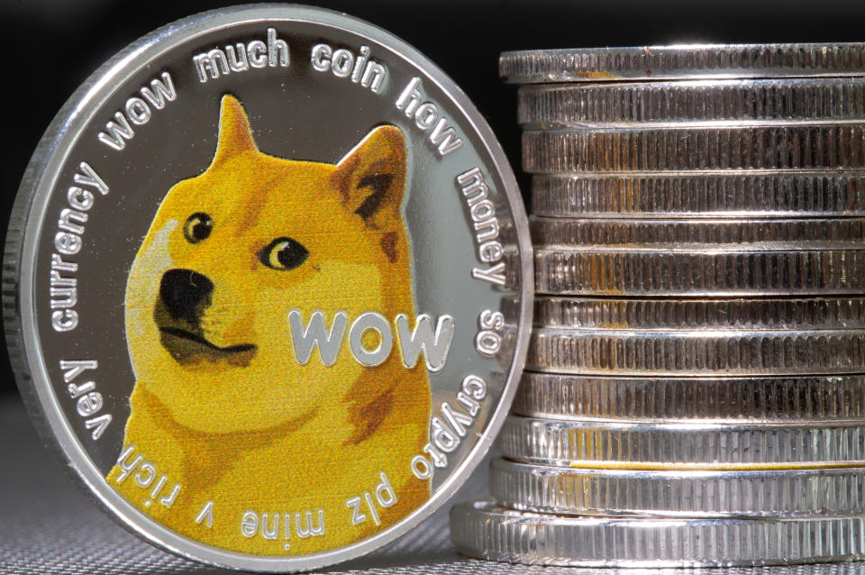 Representations of the virtual currency Dogecoin are seen in this illustration taken June 16, 2021. REUTERS/Dado Ruvic/Illustration