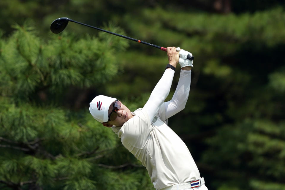 Jazz Janewattananond, of Thailand, hits from the 12th tee during the first round for the men's golf event at the 2020 Summer Olympics, Thursday, July 29, 2021, at the Kasumigaseki Country Club in Kawagoe, Japan, (AP Photo/Matt York)