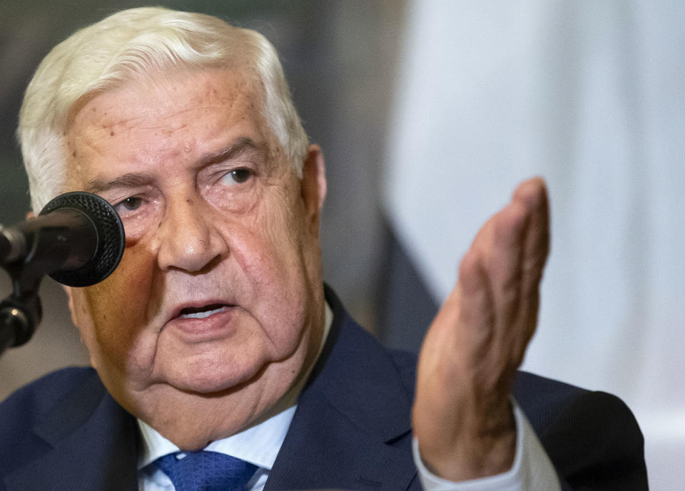 Syrian Foreign Minister Walid Muallem gestures as speaks to the media during the joint news conference with Russian Foreign Minister Sergey Lavrov, following their talks, in Moscow, Russia, Thursday, Aug. 30, 2018. Muallem's Moscow visit comes as Moscow and Damascus are increasingly worried about a possible airstrike on government positions in Syria. (AP Photo/Alexander Zemlianichenko)