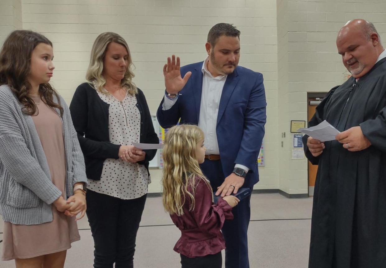 Newly elected Davidson County School Board of Education member Nick Jarvis takes the oath of office during the school board meeting on Monday.