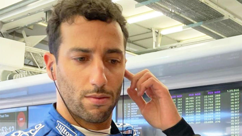 Pictured here, Daniel Ricciardo listens to his team in the McLaren garage.