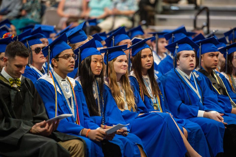 Members of the Bartram Trail High School class of 2022 listen to a speech during their commencement ceremony, held on the University of North Florida campus in Jacksonville on Tuesday, May 31, 2022.