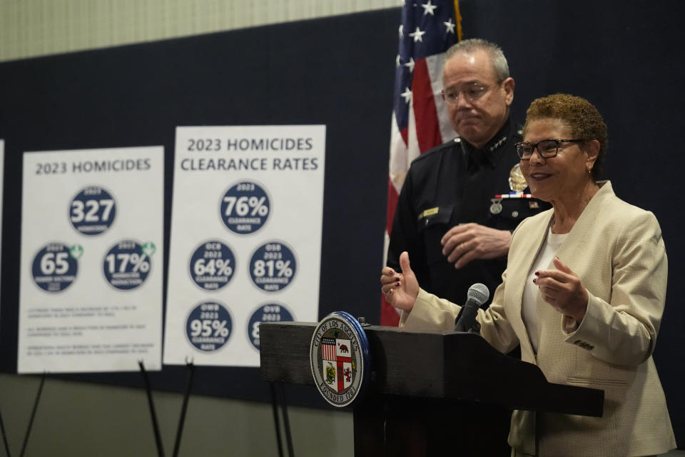 Los Angeles Mayor Karen Bass and the outgoing Los Angeles Police Chief Michel Moore discuss the city's 2023 crime statistics and safety priorities for 2024 amid the search for a new leader for the department at a news conference in Los Angeles Wednesday, Jan. 24, 2024. (AP Photo/Damian Dovarganes)