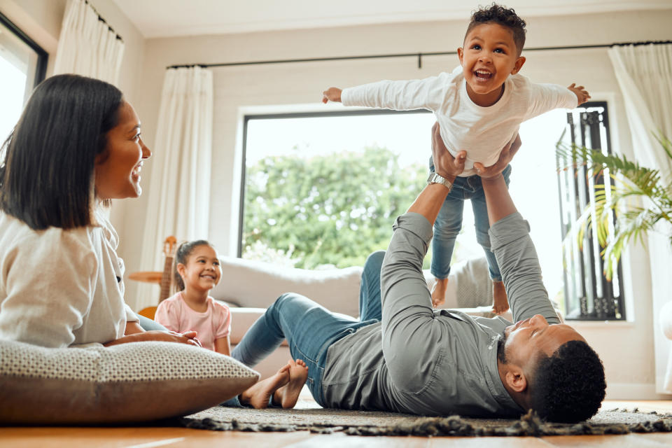 A couple playing with their kids