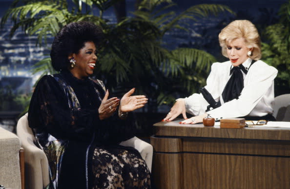 THE TONIGHT SHOW STARRING JOHNNY CARSON — Pictured: (l-r) Talk show host Oprah Winfrey during an interview with guest host Joan Rivers on January 27, 1986 — (Photo by: Paul Drinkwater/NBCU Photo Bank/NBCUniversal via Getty Images via Getty Images)