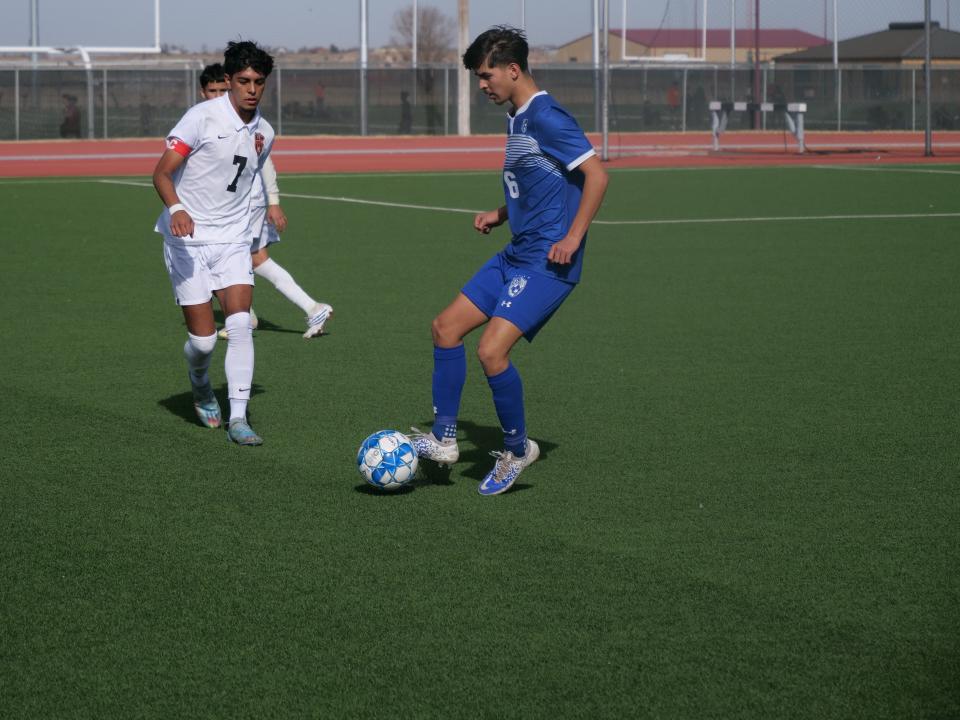 Palo Duro's Jimmy Martinez dribbles the ball as Dumas' Noe Estrada comes in to defend during a game on Saturday, January 14, 2023 at West Texas A&M University.