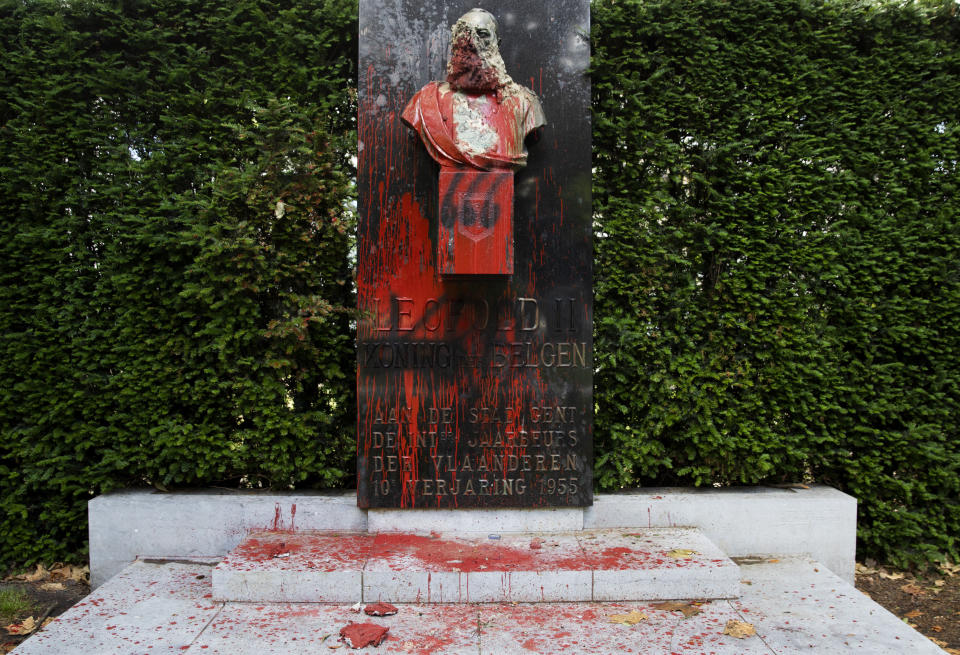 A bust of Belgium's King Leopold II, which has been damaged by red paint, graffiti and cement, at a park in Ghent, Belgium on Friday, June 19, 2020. Protests sweeping the world after George Floyd's death in the U.S. have added fuel to a movement to confront Europe's role in the slave trade and its colonial past. Leopold II is increasingly seen as a stain on the nation where he reigned from 1865 to 1909 with some demonstrators wanting him removed from public view. (AP Photo/Virginia Mayo)