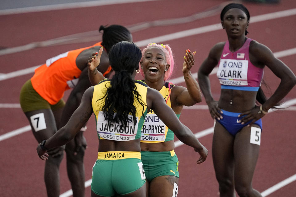 Gold medalist Shericka Jackson, of Jamaica,, silver medalist Shelly-Ann Fraser-Pryce, of Jamaica, celebrate after the final of the women's 200-meter run at the World Athletics Championships on Thursday, July 21, 2022, in Eugene, Ore. (AP Photo/Gregory Bull)