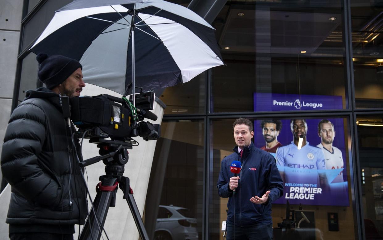 A sky sports presenter speaks to camera outside the Premier League Head Quarters on March 19, 2020 in London, - Justin Setterfield/Getty Images
