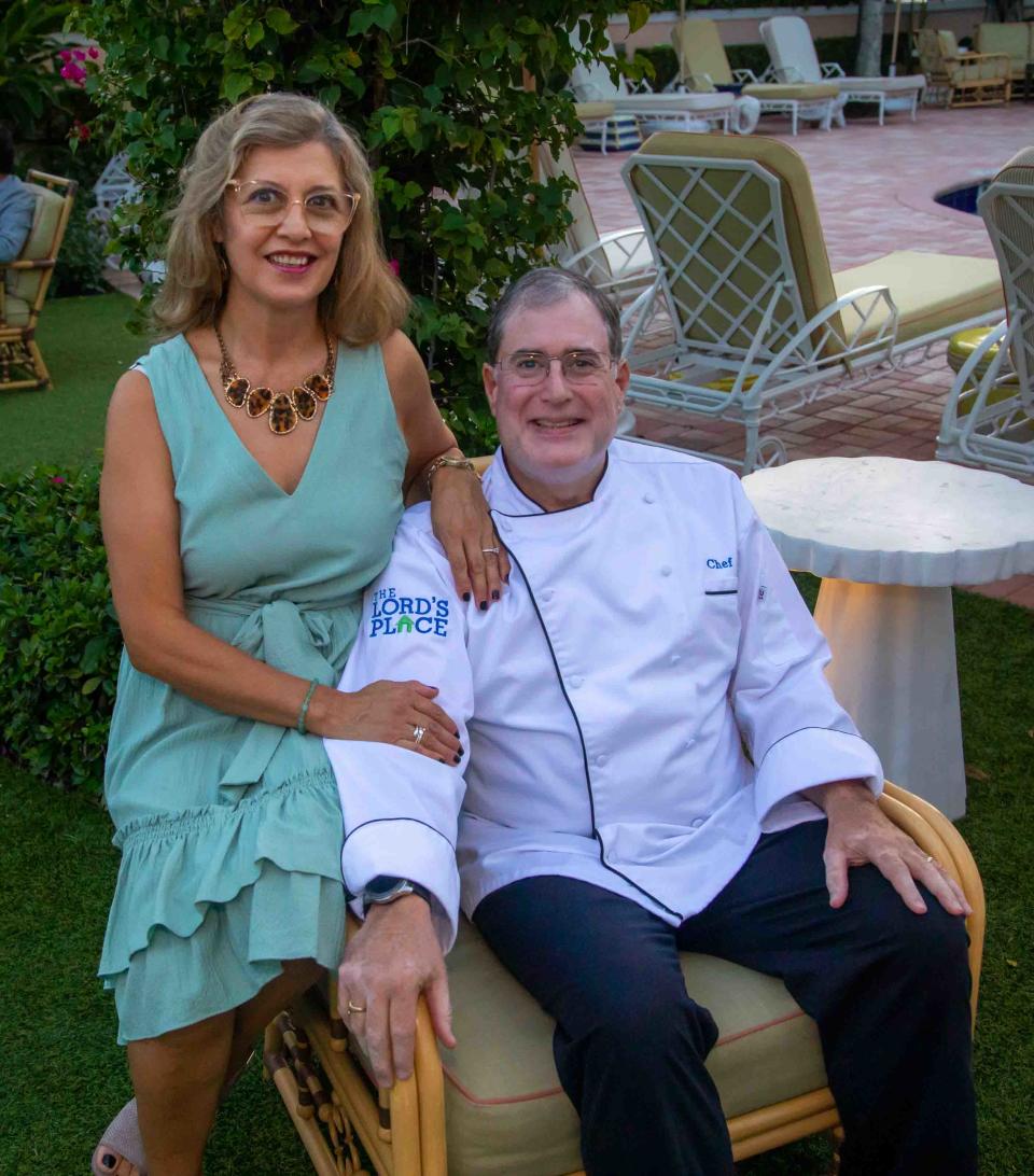 Jim Collins, director of culinary operations at The Lord's Place, and his wife Ligia participate in a celebration for Boarderie at The Colony Hotel. The food from the record-setting board was donated to The Lord's Place, which serves unhoused people.