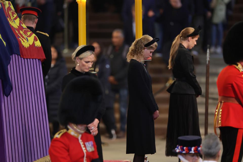 The teenager was seen at Westminster Hall standing with her head bowed in between Zara Tindall and Princess Beatrice. (Getty Images)