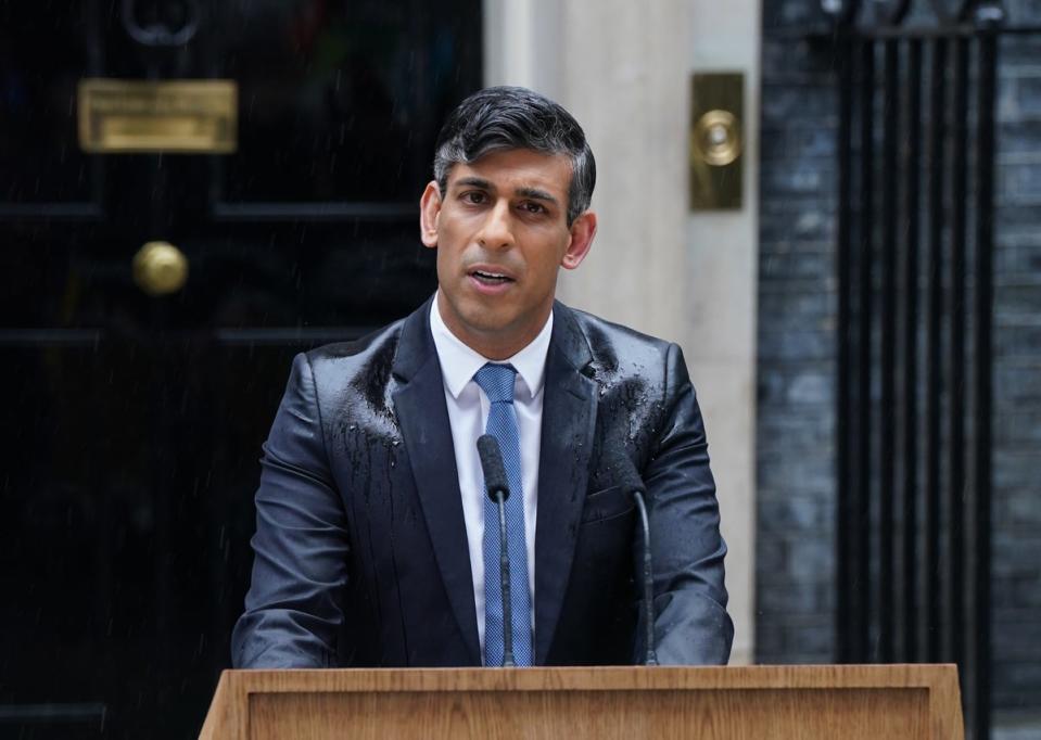 Rishi Sunak announcing the July 4 poll in the rain on Downing Street (Lucy North/PA)