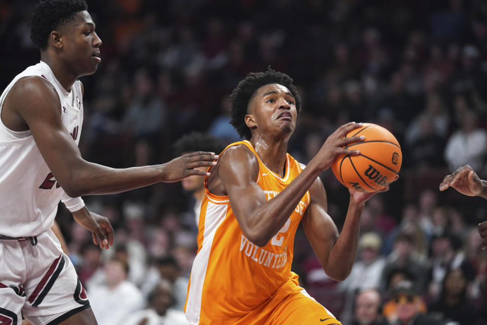 Tennessee forward Julian Phillips (2) drives to the hoop against South Carolina forward Gregory Jackson II, left, during the first half of an NCAA college basketball game Saturday, Jan. 7, 2023, in Columbia, S.C. (AP Photo/Sean Rayford)