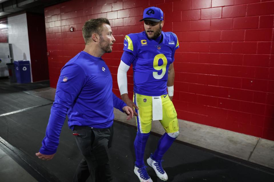 Rams coach Sean McVay and quarterback Matthew Stafford walk through the stadium tunnel in Tampa.