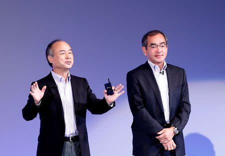 SoftBank Group Corp Chairman and CEO Masayoshi Son (L) and Honda R&D President and CEO Yoshiyuki Matsumoto attend SoftBank World 2016 conference in Tokyo, Japan, July 21, 2016. REUTERS/Kim Kyung-Hoon TPX IMAGES OF THE DAY