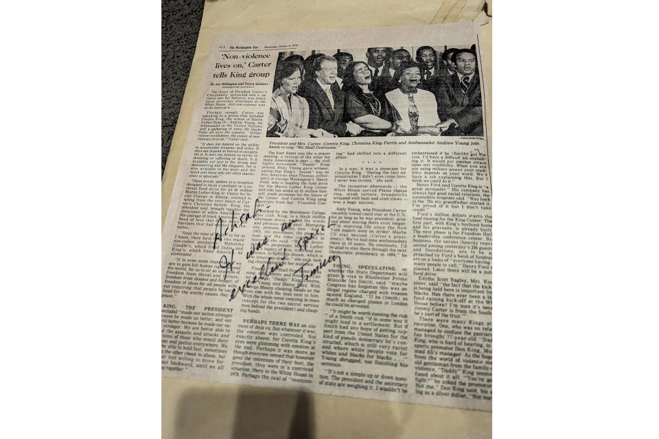 This photo taken March 14, 2024, in Alexadria, Va., shows a 1978 newspaper on which then-President Jimmy Carter wrote a personal note to one of his speechwriters, Achsah Nesmith. One of the first women to write speeches for an American president, Nesmith worked at the Carter White House for all four years of his presidency. She died March 5, 2024, in Alexandria, Va., at age 84. (AP/Susannah Nesmith)