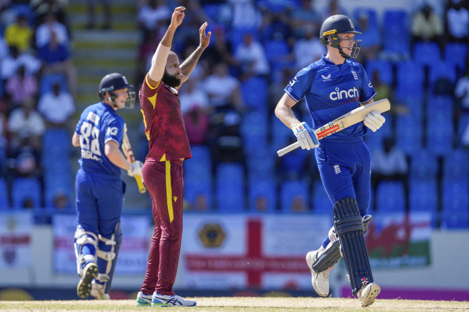England's Zak Crawley scores runs as West Indies' bowler Yannic Cariah gestures during the first ODI cricket match at Sir Vivian Richards Stadium in North Sound, Antigua and Barbuda, Sunday, Dec. 3, 2023. (AP Photo/Ricardo Mazalan)
