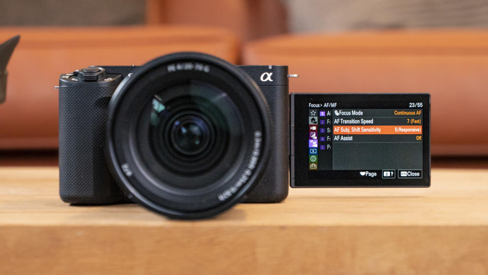 The Sony ZV-E1 camera sitting on a wooden table