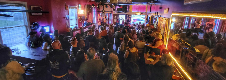 This photo provided by Leah Epling in January 2023 shows a performance at The Lipstick Lounge in Nashville, Tenn. While the bar is home to its share of trivia nights and drag shows, it has also hosted Sunday worship services, weddings and funerals. (Leah Epling via AP)