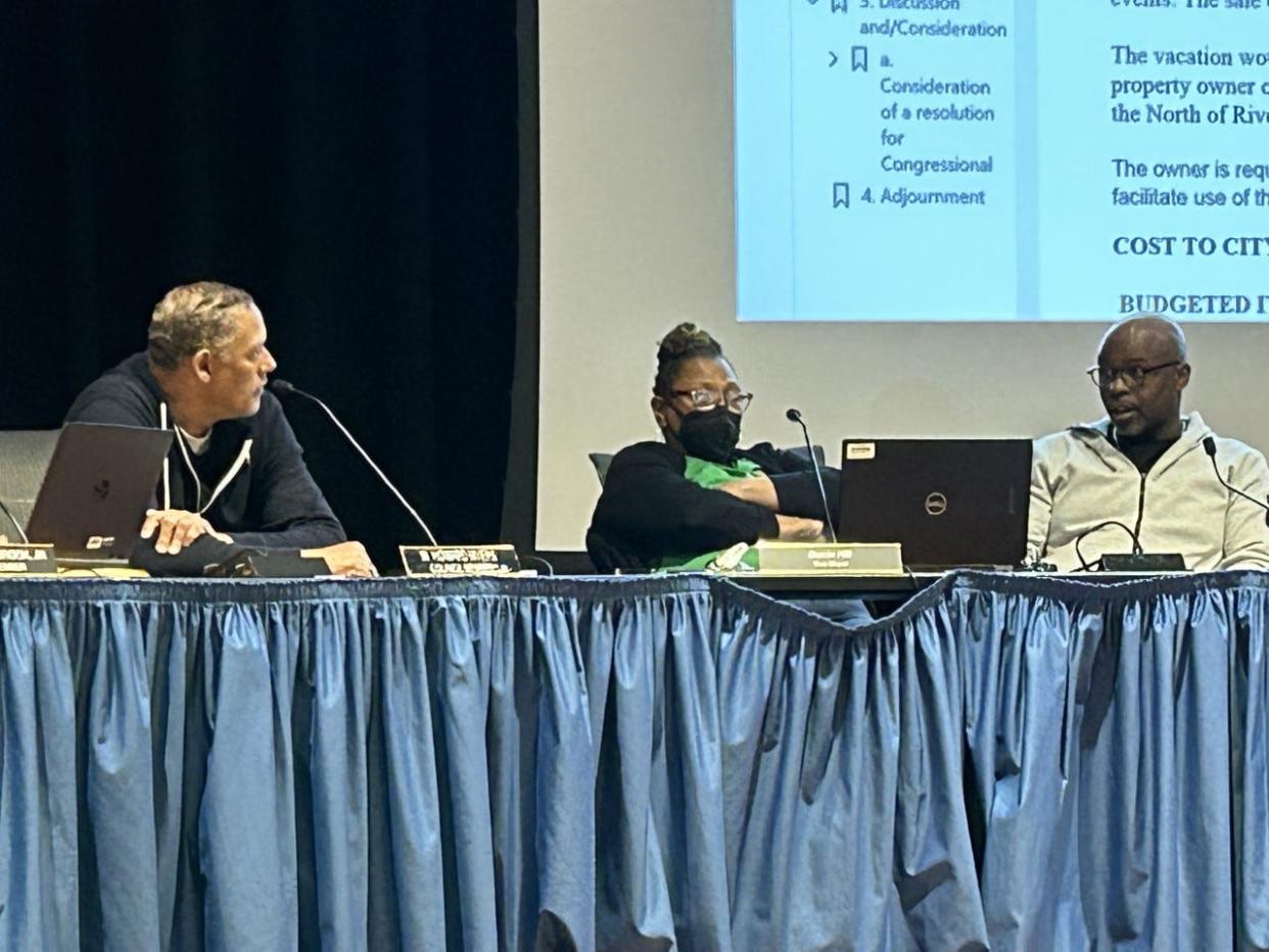 Petersburg Councilor Annette Smith-Lee, center, listens as her colleagues, Councilor Howard Myers, left, and Vice Mayor Darrin Hill discuss Hill's opposition to vacating a portion of River Street in downtown Petersburg for a green entertainment venue. The discussion took place during a special meeting of City Council Wednesday, March 8, 2023 at the Petersburg Public Library.