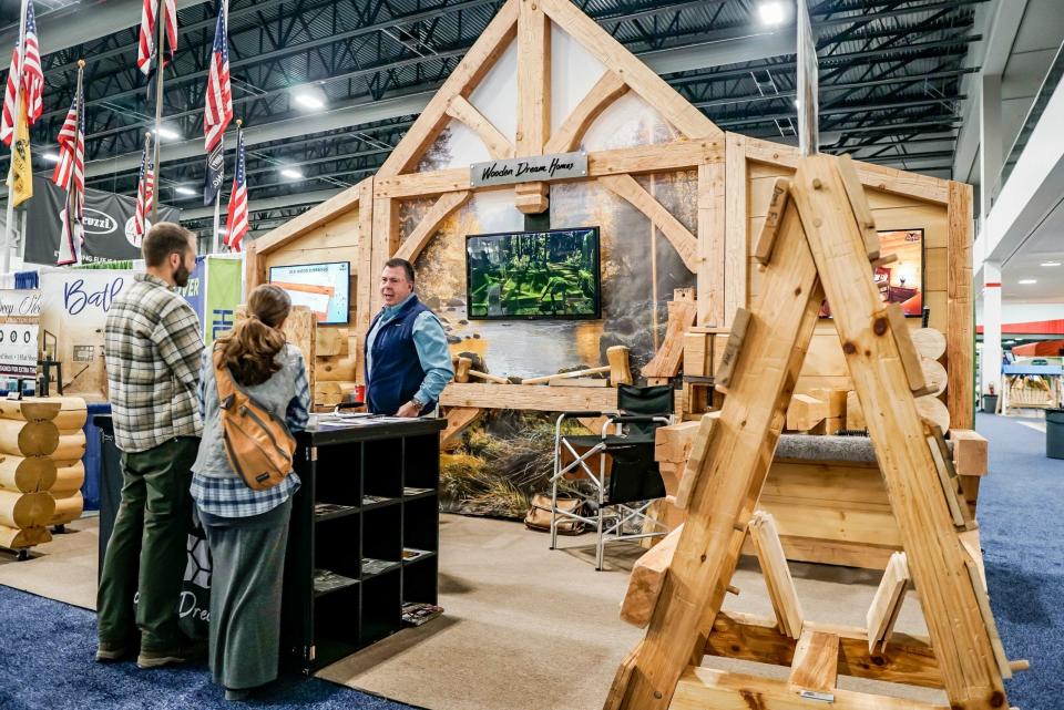 Wooden house display at the Cottage & Lakefront Living Show.