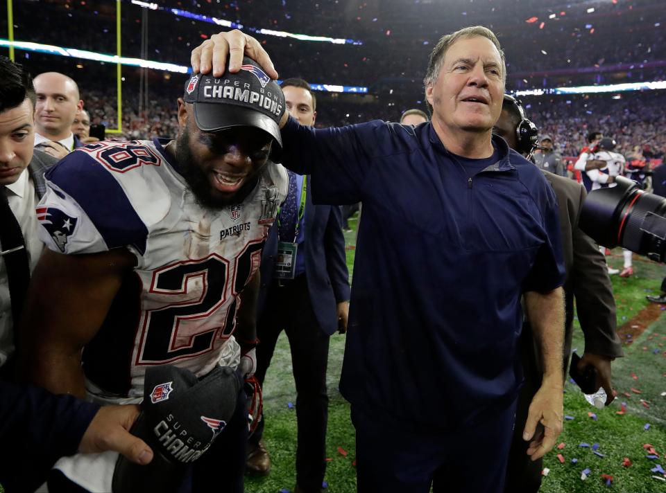 Patriots head coach Bill Belichick celebrates with running back James White after the Pats defeated the Atlanta Falcons in Super Bowl LI on Feb. 5, 2017, in Houston.