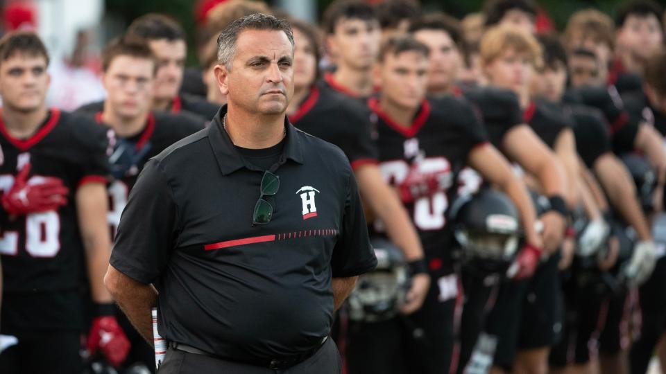 Haddonfield High School's head football coach Frank DeLano stands with his players during the playing of the national anthem prior to the football game between Haddonfield and Paulsboro played at Haddonfield High School on Friday, September 1, 2023.  Haddonfield defeated Paulsboro, 35-7.  