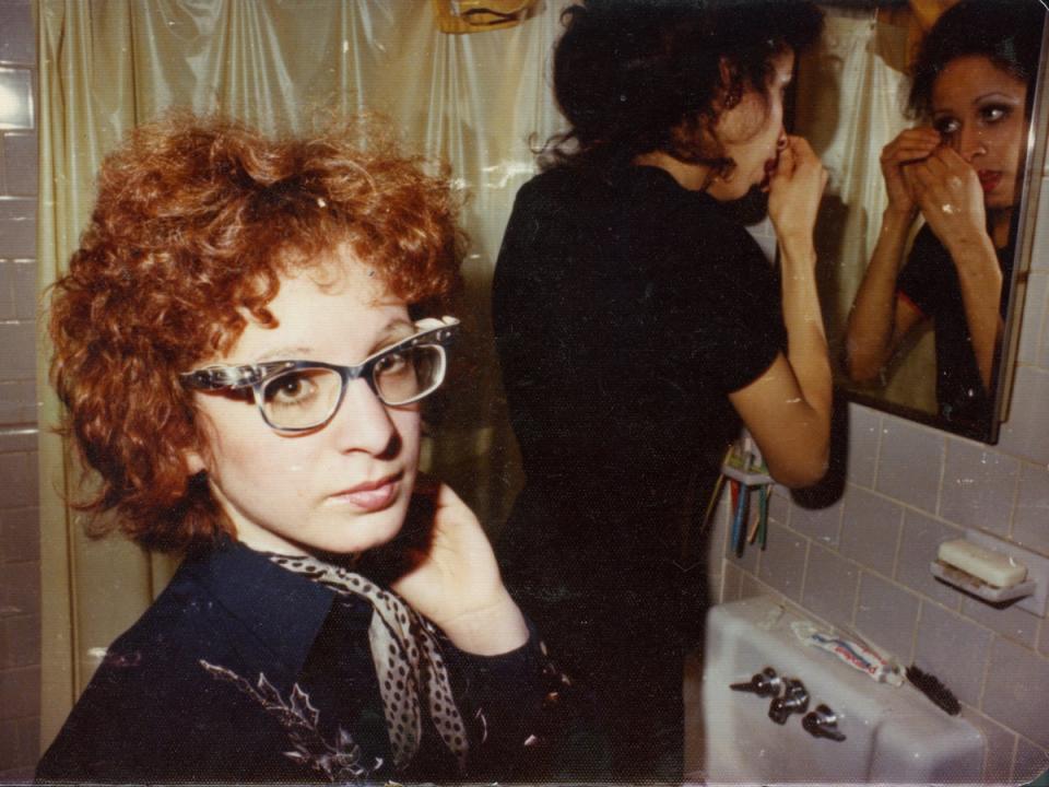 Goldin in the bathroom with a roommate, Boston, circa 1970s (Nan Goldin)