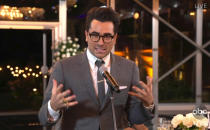 In this video grab captured on Sept. 20, 2020, courtesy of the Academy of Television Arts & Sciences and ABC Entertainment, Daniel Levy accepts the award for outstanding writing for a comedy series for "Schitt's Creek" during the 72nd Emmy Awards broadcast. (The Television Academy and ABC Entertainment via AP)