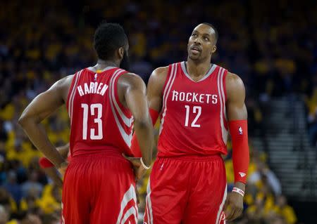 Apr 27, 2016; Oakland, CA, USA; Houston Rockets guard James Harden (13) and center Dwight Howard (12) between plays during the third quarter in game five of the first round of the NBA Playoffs at Oracle Arena. Mandatory Credit: Kelley L Cox-USA TODAY Sports / Reuters Picture Supplied by Action Images