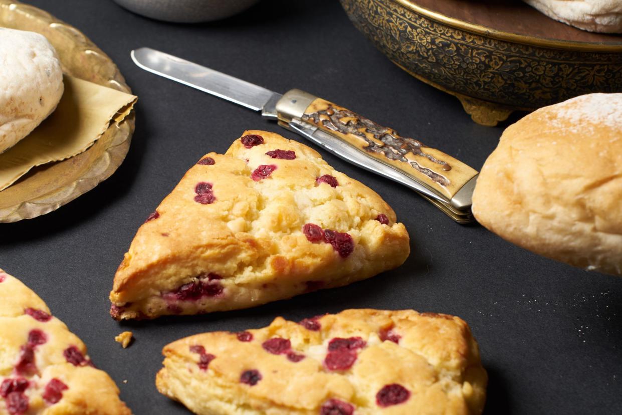 cranberry scone on black table